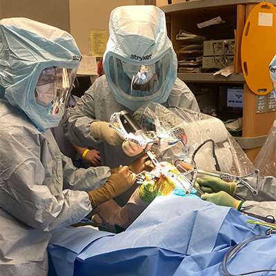 Surgeon Controls the Robotic Arm During Surgery